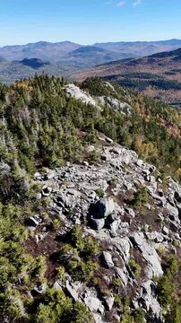 Fall Colours in the White Face Mountain ski resort and lake. Color Change, Vermont, USA.