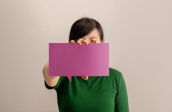 Woman holding a blank square card, communication, identity, messaging