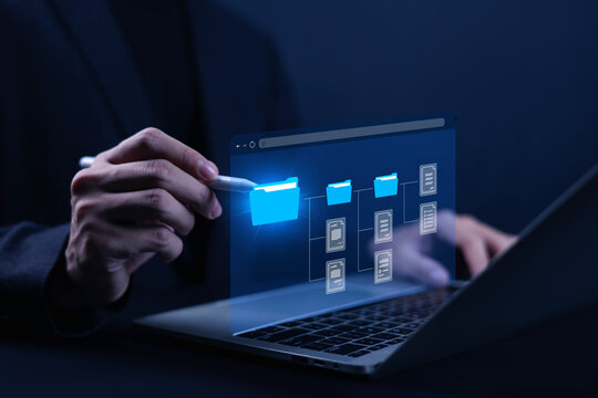 Digital file management concept showing organized folders and documents on a laptop, representing data storage, document organization, workflow, information management, and secure digital access.