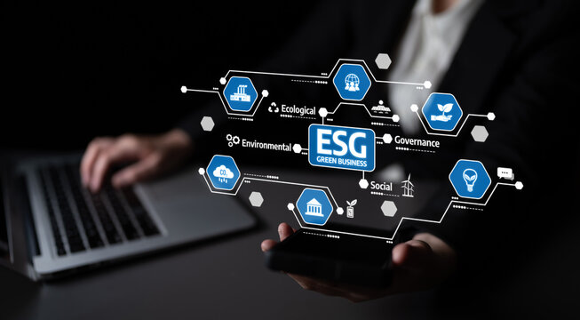 A professional individual uses technology to explore ESG principles focused on ecological, social, and governance factors for better business strategies and growth. Tessel