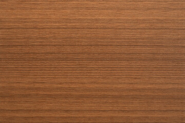 Naklejka premium Natural teak wood texture with rich golden-brown tones, fine grain, and subtle organic variations. High-resolution seamless surface, ideal for furniture, flooring, cabinetry, interiors, and background