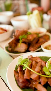 Traditional Thai Isan Grilled Pork Jowl and Roasted Chicken Meal