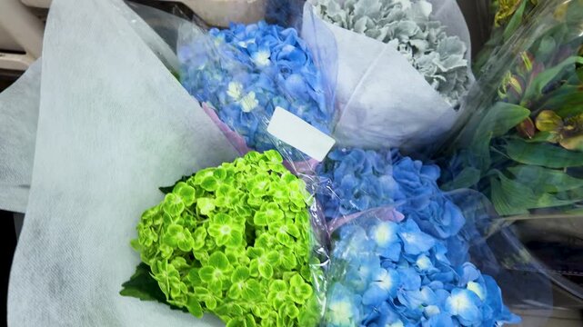 Blue and Green Hydrangea Bouquets at a Flower Market