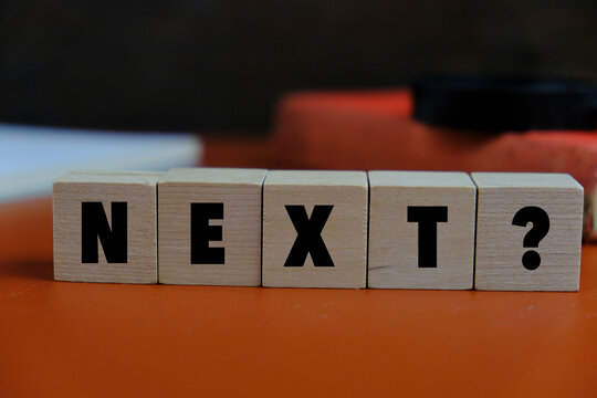 text of NEXT on the wooden block. Education, business, Financial and office concept.
