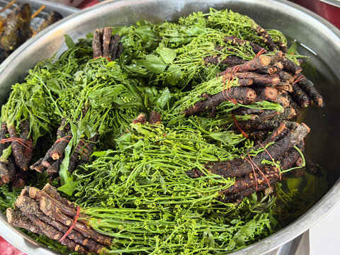 fresh and dried herbs for sale at the local market.