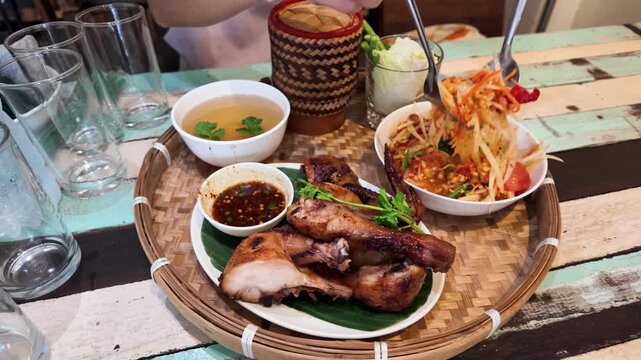 Thai Grilled Chicken and Papaya Salad Served on Woven Tray
