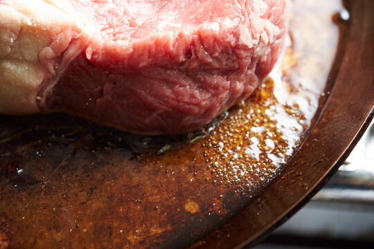 Beef steak in an iron pan