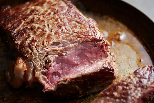 Beef steak in an iron pan