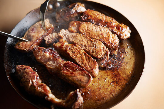 Beef steak in an iron pan