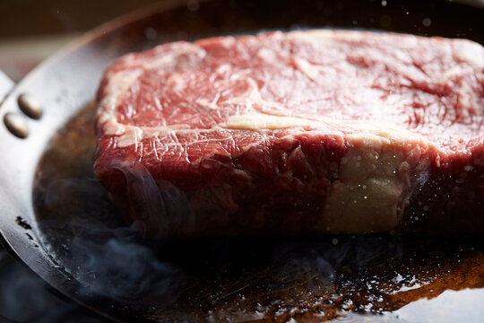 Beef steak in an iron pan