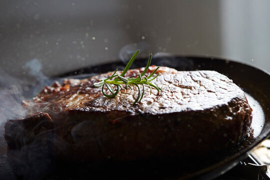 Beef steak in an iron pan