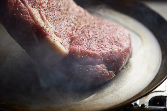 Beef steak in an iron pan