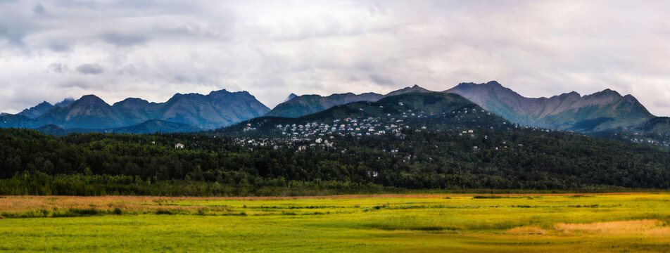 Alaska summer landscape at Potter Marsh Wildlife Refuge with view of Chugach Mountains and Rabbit Creek in Anchorage USA