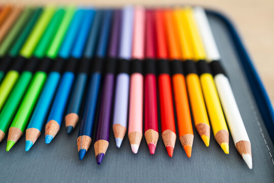 close-up of vintage colored pencils set neatly stored in pencil case, focus on the tips from 30 years old pencils