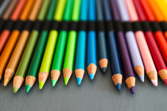 close-up of vintage colored pencils set neatly stored in pencil case, focus on the tips from 30 years old pencils