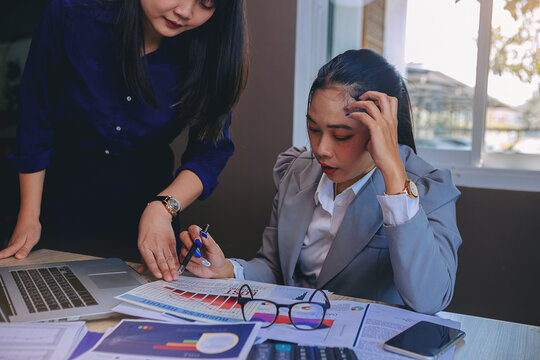 Talking about serious business. Business peoples meeting, discuss about business problem and bad business result. Selected focus