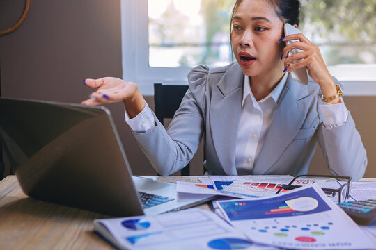 Businesswomen use telephones to explain business plans and persuade business partners to invest together.. Selected focus.