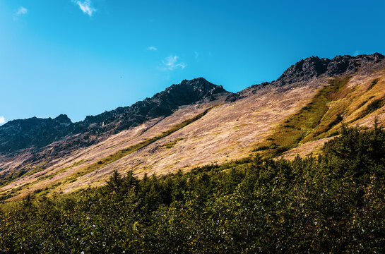 Volcanic rocks at the summit of Chugach Mountains in Anchorage Alaska viewed from Glen Alps Hiking Trail