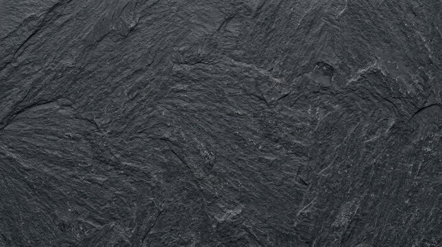 Dark gray slate stone texture background with natural rough rock surface