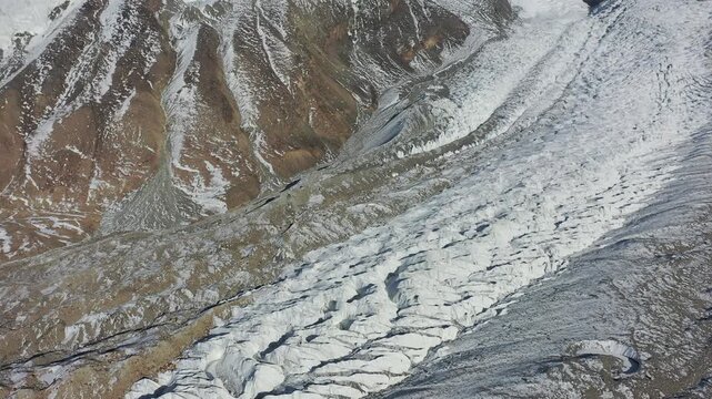 Aerial drone view of Muztagh Ata Glacier No.3 in Xinjiang China showing majestic snow mountains and ice textures