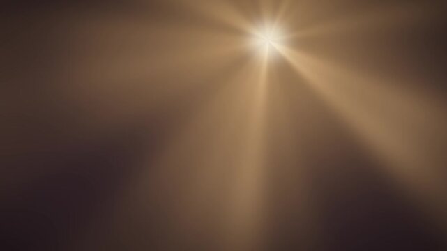 Volumetric light rays radiating god ray beams abstract dark background seamless loop in vibrant gold tones