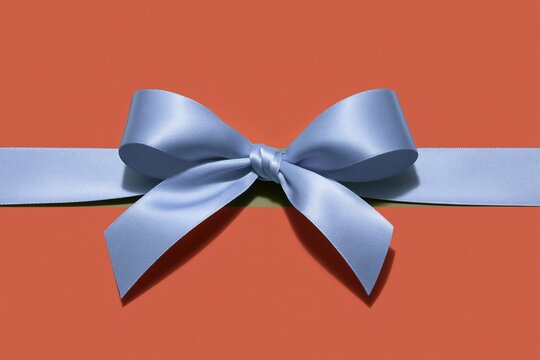 Lavender satin ribbon tied in a bow on a coral red surface, featuring a smooth texture and soft lighting for gift packaging and banners