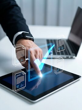 Close up of a person using a tablet to sign digital documents with a glowing checkmark representing approval, verification, and compliance