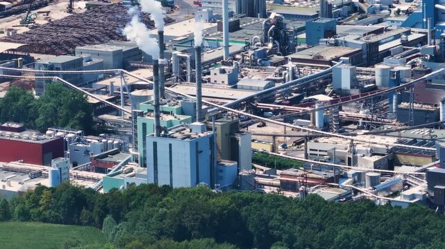 Aerial view of Lenzing Plastics manufacturing plant smoking chimneys