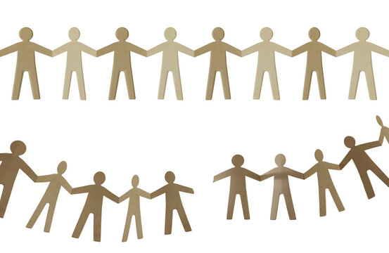 Paper doll chain of people holding together and separated representing unity teamwork helping community cooperation and disconnection