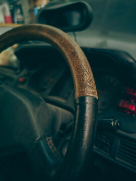 Worn Leather Steering Wheel Close-Up in Vintage SUV