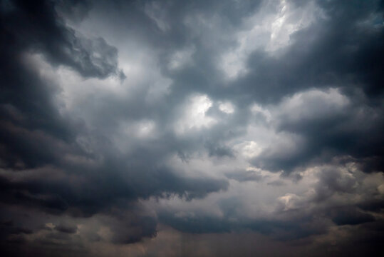 Dark and Moody Thunderstorm Clouds Forming in the Sky Before Heavy Rainfall and Severe Weather,
Dark sky with stormy clouds,Dark clouds before a thunder-storm,clouds before rain