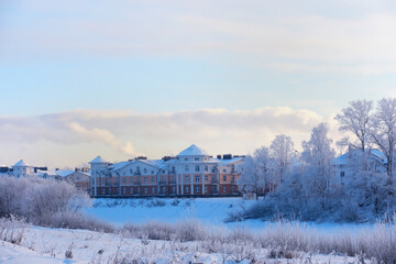 Fototapeta premium Winter landscape. Trees and plants covered with snow. The beauty of snow covered paths. Snowfall and cooling in tourist areas.