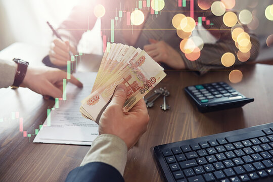 Businessman counting money, Russian ruble currency, while making an agreement contact with his partner in the office - loan and financial concept