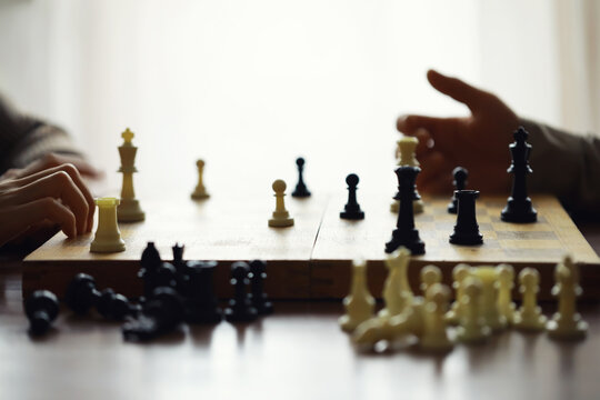 Hand playing game of chess, competition, strategy, battle, play