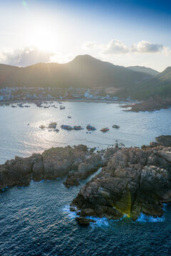 Panoramic aerial view of Nhon Hai fishing village, beach, and sparkling sea in Binh Dinh province, Vietnam