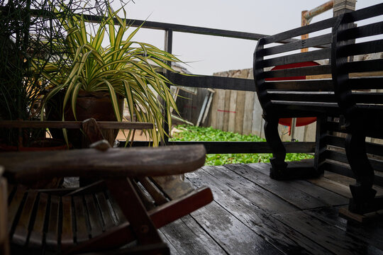 potted plants on cozy riverside wooden deck