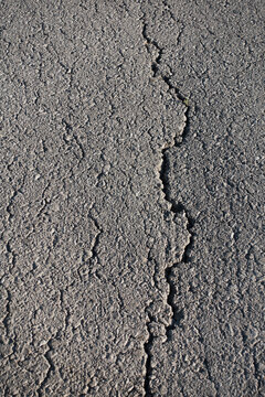 Cracked Asphalt Surface Texture and Abstract Background