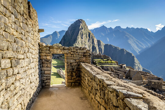 Ancient Inca Stone Doorway framing Huayana Picchu at Machu Picchu, Peru