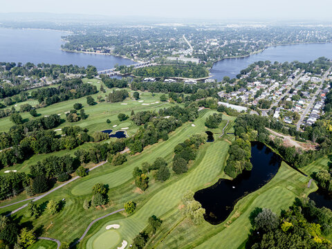 Aerial view of lush golf course near Laval Quebec Canada with ponds, trees and fairways. g.