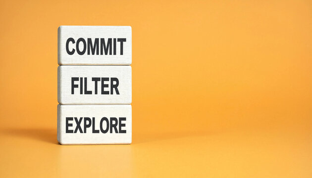 Commit filter explore concept with stacked wooden blocks on orange background for decision making strategy