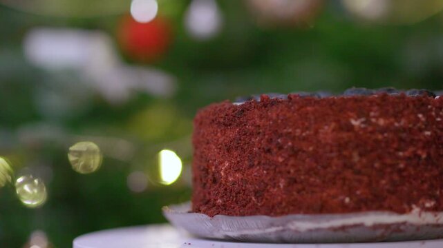 Festive Red Velvet Cake with Blueberries and Holiday Bokeh Lights