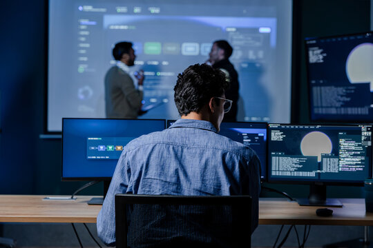 AI Engineer Monitoring Machine Learning System Performance, Reviewing Model Metrics Across Multiple Screens. Software Developer Working at Multi Monitor and Analyzing Artificial Intelligence System.