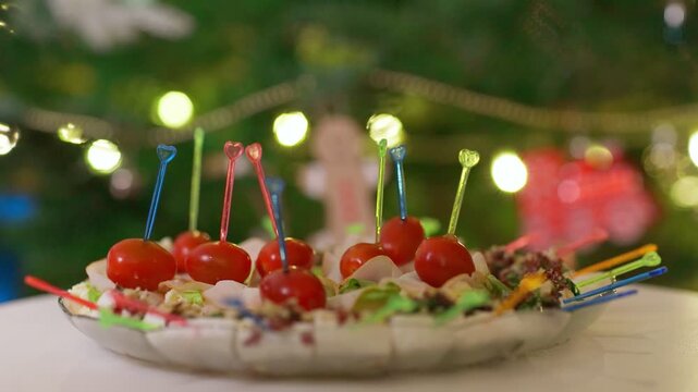 Close-up of Festive Appetizers with Cherry Tomatoes and Bokeh Lights
