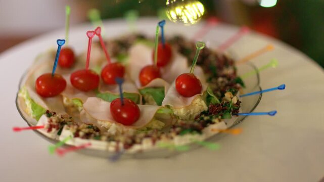 Festive Plate of Gourmet Appetizers with Cherry Tomatoes and Meat Skewers