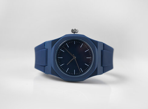 Blue Analog Wristwatch with Minimalist Dial and Matching Blue Strap on White Background