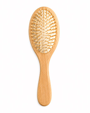 Wooden paddle hair brush on white background