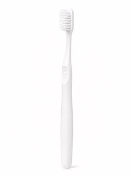 Simple white toothbrush on plain surface