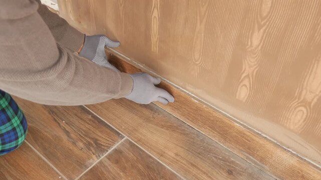 Removing old wall insulation in a home renovation