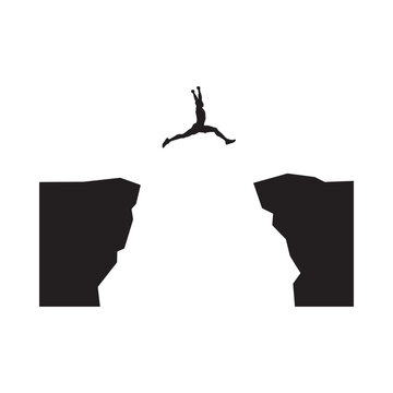 Jumping person silhouette between two rock formations on a white background