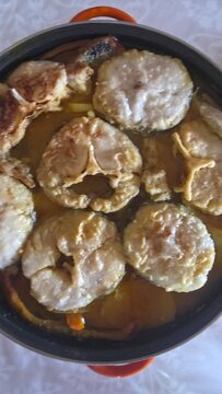 preparation and cooking of hake in a casserole dish, gastronomy